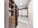 Organized walk-in closet with custom shelving, drawers, and hanging rods at 1820 Peachtree Nw St # 1207, Atlanta, GA 30309