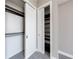 Bright, walk-in closet with multiple rods and shelves provide ample storage space at 1820 Peachtree Nw St # 1207, Atlanta, GA 30309