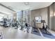 Bright gym with large windows and modern fitness equipment including treadmills and stationary bikes at 1820 Peachtree Nw St # 1207, Atlanta, GA 30309