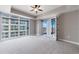 Open bedroom features new carpeting, a ceiling fan and large window at 1820 Peachtree Nw St # 1207, Atlanta, GA 30309