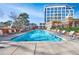 Resort-style swimming pool with plenty of lounge seating at 1820 Peachtree Nw St # 1207, Atlanta, GA 30309