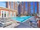 Beautiful swimming pool surrounded by lounge seating and manicured grounds at 1820 Peachtree Nw St # 1207, Atlanta, GA 30309