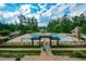 Aerial view of community pool, amenities, and surrounding landscape, showcasing the neighborhood's appeal at 223 Misty View Dr, Canton, GA 30114