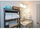 The bathroom featuring open shelving, granite countertops, and modern fixtures creating a functional space at 223 Misty View Dr, Canton, GA 30114