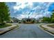 Stately clubhouse entrance with colorful landscaping and American flag at 223 Misty View Dr, Canton, GA 30114