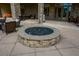 Outdoor living space with a stone fire pit, seating area, and patio perfect for entertaining at 223 Misty View Dr, Canton, GA 30114