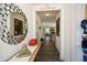 Bright foyer with hardwood floors, decorative mirror, and stylish decor leading into the home at 223 Misty View Dr, Canton, GA 30114