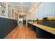 Bright hallway featuring upper cabinets, granite counters, decor, and wood floors at 223 Misty View Dr, Canton, GA 30114