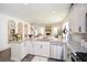 Open kitchen with granite countertops, stainless steel appliances, and an island at 223 Misty View Dr, Canton, GA 30114