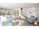 Open concept living space connects to the kitchen and staircase, bright and airy at 223 Misty View Dr, Canton, GA 30114