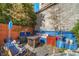 Cozy backyard area featuring a fire pit, ample seating, mature foliage, and a privacy fence for outdoor enjoyment at 307 Cherokee Se Ave # 9, Atlanta, GA 30312