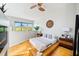 Stylish bedroom with statement wall clock, wood accents, and bright, airy ambiance at 307 Cherokee Se Ave # 9, Atlanta, GA 30312