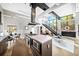 Open concept kitchen with stainless steel appliances, modern cabinets, and stairs leading to second level at 307 Cherokee Se Ave # 9, Atlanta, GA 30312