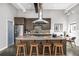 Contemporary kitchen with stainless steel appliances, gas cooktop, bar seating, and industrial-chic design elements at 307 Cherokee Se Ave # 9, Atlanta, GA 30312