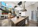 Kitchen with stainless steel appliances, large island, modern vent hood, and open floor plan at 307 Cherokee Se Ave # 9, Atlanta, GA 30312
