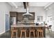 Modern kitchen featuring a stainless steel fridge, breakfast bar with seating, and sleek cabinetry at 307 Cherokee Se Ave # 9, Atlanta, GA 30312