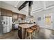 Stylish kitchen with an island, stainless steel refrigerator, modern cabinetry, and industrial-style design details at 307 Cherokee Se Ave # 9, Atlanta, GA 30312