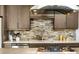 Kitchen with stainless steel appliances, stylish backsplash, and lots of cabinet space at 307 Cherokee Se Ave # 9, Atlanta, GA 30312