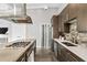 Spacious kitchen with stainless steel appliances, stone backsplash, and concrete floors at 307 Cherokee Se Ave # 9, Atlanta, GA 30312