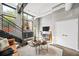 Contemporary living room with a sleek console, stylish decor, and large windows providing natural light and views at 307 Cherokee Se Ave # 9, Atlanta, GA 30312