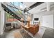 Modern living room with high ceilings, large windows, comfortable seating, and a staircase leading to the upper level at 307 Cherokee Se Ave # 9, Atlanta, GA 30312
