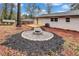 Inviting backyard with a wooden deck, fire pit, and lush landscaping at 2254 Glendale Drive, Decatur, GA 30032