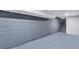 Spacious basement featuring painted concrete walls, floors, and steps leading upstairs at 2254 Glendale Drive, Decatur, GA 30032
