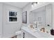 Bright bathroom with double vanity, gold fixtures, and walk-in shower at 2254 Glendale Drive, Decatur, GA 30032