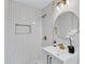 A modern bathroom with white subway tile in the shower and gold fixtures at 2254 Glendale Drive, Decatur, GA 30032