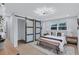 A bright bedroom features sliding closet doors, a decorative bench, and overhead lighting at 2254 Glendale Drive, Decatur, GA 30032