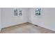 Bright bedroom features hardwood floors and two windows providing natural light at 2254 Glendale Drive, Decatur, GA 30032