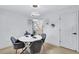 Inviting dining area featuring modern light fixtures and neutral decor, adjacent to the kitchen at 2254 Glendale Drive, Decatur, GA 30032