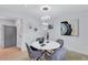 Modern dining area with a white marble table, stylish seating, and unique lighting fixture at 2254 Glendale Drive, Decatur, GA 30032