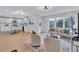 Open-concept living room flowing into a modern, all-white kitchen at 2254 Glendale Drive, Decatur, GA 30032