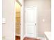 Hallway view with closet and white door at 3194 Ivy Farm Path, Buford, GA 30519