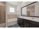 Bathroom features double vanity, bathtub, and separate tile surround shower at 1326 Harlequin Way, Stockbridge, GA 30281