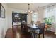 Formal dining room with hardwood floors, modern chandelier, and sophisticated decor at 1326 Harlequin Way, Stockbridge, GA 30281