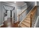 Welcoming foyer with hardwood floors and staircase, leading to the upper level of the home at 1326 Harlequin Way, Stockbridge, GA 30281