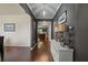 Elegant foyer with hardwood floors, neutral walls, and stylish decor leading to other rooms at 1326 Harlequin Way, Stockbridge, GA 30281