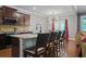 Stylish eat-in kitchen with granite counters, a large island, and modern light fixtures at 1326 Harlequin Way, Stockbridge, GA 30281