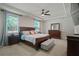 Spacious main bedroom with tray ceiling and a large window bringing in natural light at 1326 Harlequin Way, Stockbridge, GA 30281