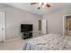 Spacious bedroom featuring carpet, ceiling fan, and neutral paint to create a peaceful retreat at 1459 Hedgewood Nw Ln, Kennesaw, GA 30152