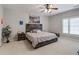 Bedroom featuring a decorative wood headboard and a window with natural lighting, creating a comfortable space at 1459 Hedgewood Nw Ln, Kennesaw, GA 30152