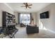 Carpeted bonus room features a large window, a modern desk, and black bookshelves at 1459 Hedgewood Nw Ln, Kennesaw, GA 30152