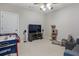 Versatile bonus room featuring an air hockey table, media console, and comfortable seating at 1459 Hedgewood Nw Ln, Kennesaw, GA 30152