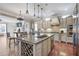 Open concept kitchen with a central island and modern stainless steel appliances at 1459 Hedgewood Nw Ln, Kennesaw, GA 30152