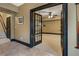 Carpeted basement office features glass french doors and neutral colors at 1459 Hedgewood Nw Ln, Kennesaw, GA 30152