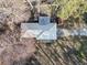 Aerial view of home with metal roof, mature trees, and a long driveway on a sunny day at 17 Cross Creek Pkwy, Dallas, GA 30157