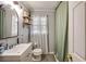 Bathroom features a large mirror, updated vanity, toilet, and shower with curtains at 17 Cross Creek Pkwy, Dallas, GA 30157