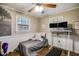 Functional bedroom featuring a daybed, wood floors, and lots of natural light from two windows at 17 Cross Creek Pkwy, Dallas, GA 30157